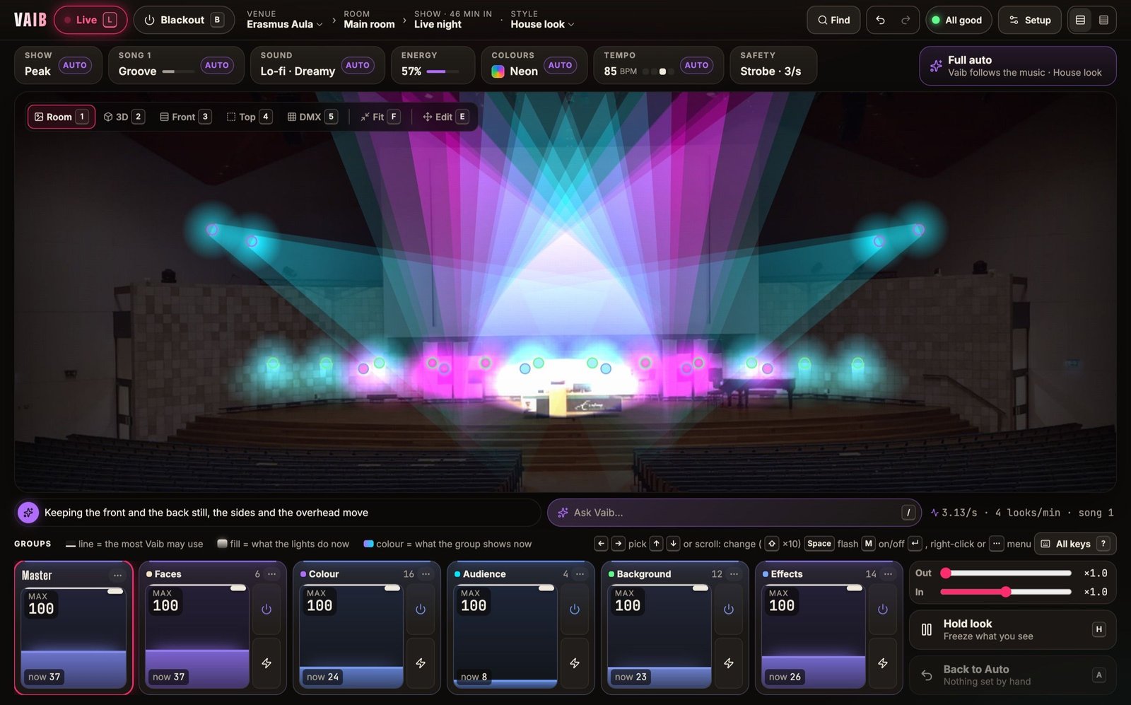 The Vaib desk, Live at Erasmus Aula: a photo of an auditorium stage lit violet by beams from a truss of moving lights, with the show controls above and six group strips below.